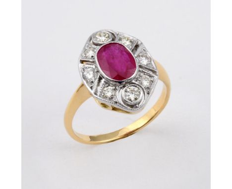 A RUBY AND DIAMOND CLUSTER RING. the oval-shaped ruby is set within a surround of circular-cut diamonds, in gold. Size M.  **