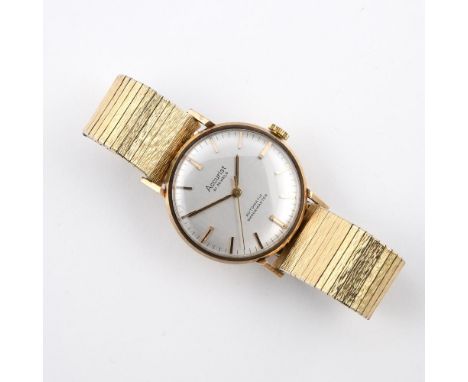 A GENTLEMAN'S GOLD AUTOMATIC WRISTWATCH BY ACCURIST. the signed circular dial with baton numerals, on a stainless steel and g
