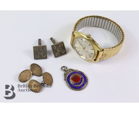 Two pairs of silver cufflink's and a silver and enamel badge Bodmin Ambulance Motor Trial Special Award. This lot includes a&