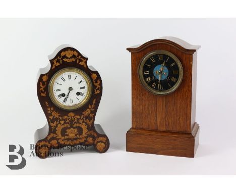 Duval A. Paris mantel clock, having a white enamel face with Roman dial, strikes to a bell, the case having decorative inlay,