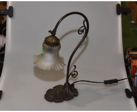 A Tiffany style table lamp with frosted glass shade