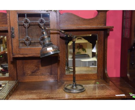 An early 20th century copper table lamp