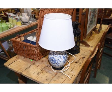 A blue and white ceramic ginger jar mounted as a table lamp