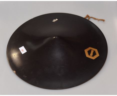 A Japanese conical lacquered hat with single hexagonal gilt motif decoration, the underside fitted with two rolled cushion pa
