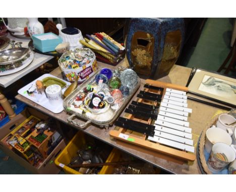 Two trays inc. glass paper weights, vintage badges, Poole pottery nut dish etc; tog. with a xylophone 