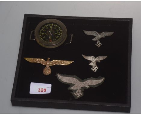 A group of World War II German Luftwaffe regalia comprising a NCO's woven cloth side-cap badge; a gilt metal officers badge; 
