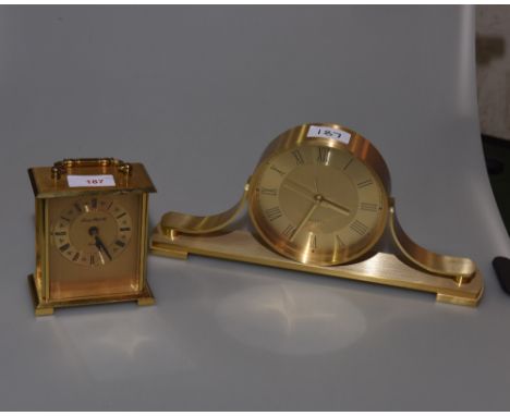 A modern London Clock Company carriage clock, together with a 'Quartz' brass cased mantel clock (2)