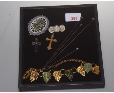 A gilt metal vine leaf pendant necklace, two crosses, four hat pins, a threepenny piece brooch