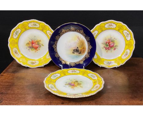 A Royal Worcester circular plate, painted by G. Johnson, signed, with a moorhen and chicks, gilded blue border, 23cm diameter
