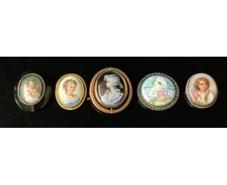 A 19th century enamel oval portrait mourning brooch, the revolving centre with ringlet haired classical maiden, glazed verso,