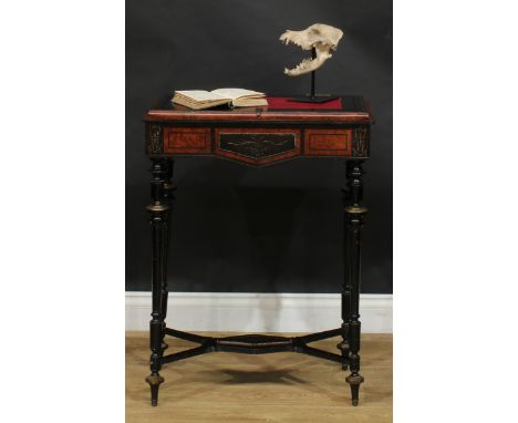 A 19th century brass mounted amboyna and ebonised table, shaped apron, turned and fluted supports, shaped X-stretcher, arrow 