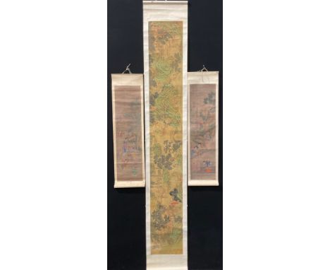 A Chinese scroll painting, depicting a narrative scene with figures in a landscape, the image 28.5cm x 200.5cm, inscription a