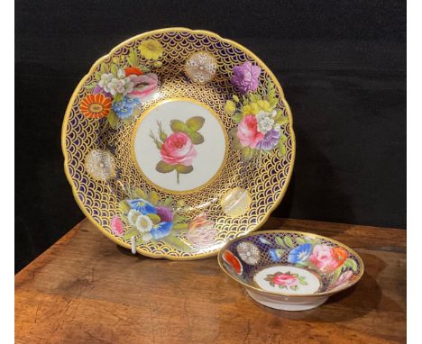 A Spode circular plate, with circular cartouche painted with a pink rose, within a border painted with brightly coloured flow