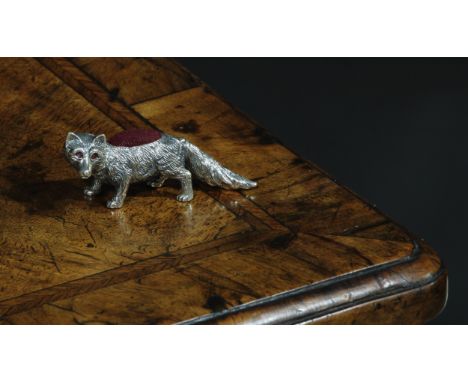 A sterling silver novelty pin cushion, as a fox, ruby eyes, 6cm long 