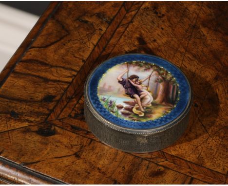 A Continental silver and enamel circular snuff box, hinged cover decorated in polychrome with a courting couple on a swing, w