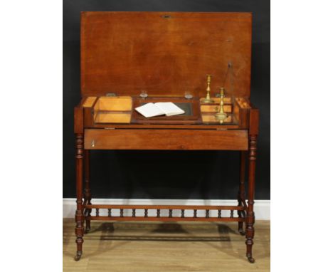 A late 19th century mahogany chamber writing table or desk, hinged rectangular top and fall front frieze enclosing a writing 