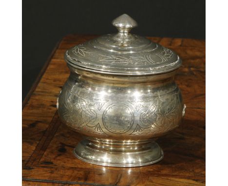 A 19th century Russian silver circular pedestal tea caddy, chased and wrigglework engraved with flowers and leaves, 9.5cm dia