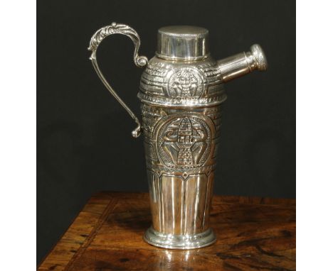 A South American Art Deco period silver cocktail shaker, embossed with stylised geometric Pre-Columbian motifs, scroll handle