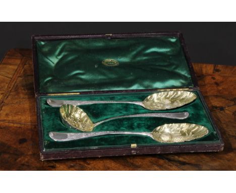 A pair of George III silver Hanoverian pattern berry spoons, with sifter en suite, gilt bowls, the spoons London 1782, the si