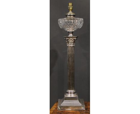 A late Victorian/Edwardian E.P.N.S Corinthian column table oil lamp, faceted glass reservoir, stepped square base, 64cm high 