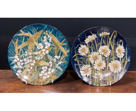 An Aesthetic Movement circular charger, painted by Florence Cowper, with white and pink river arrowhead flowers on a mottled 