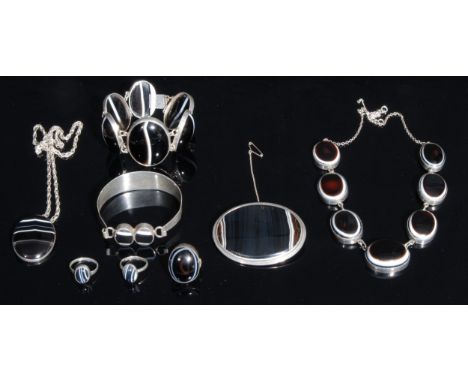 A silver mounted banded agate graduated six panel bracelet;  two panel bangle,  seven panel necklace;  oval brooch, dress rin