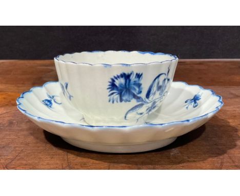 A Worcester fluted Gilliflower pattern tea bowl and saucer, crescent mark, c.1770 