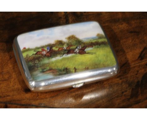 A Victorian silver and enamel rounded rectangular cigarette case, hinged cover decorated with a horse racing scene, 8.5cm wid