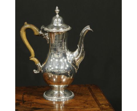 A George III Provincial silver baluster coffee pot, hinged domed cover with acorn finial, beaded borders, fruitwood scroll-ca
