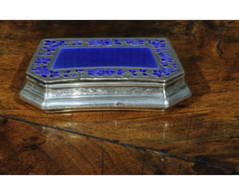 An early 20th century French silver and enamel lozenge shaped snuff box, hinged cover with blue guilloche field within a band