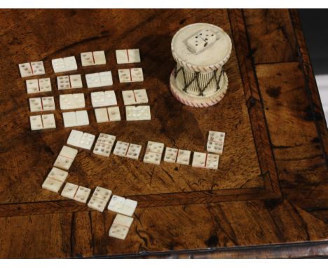 An early 19th century French Napoleonic Prisoner-of-War carved bone Domino set, the case as a Drum, with fret cut sides and s