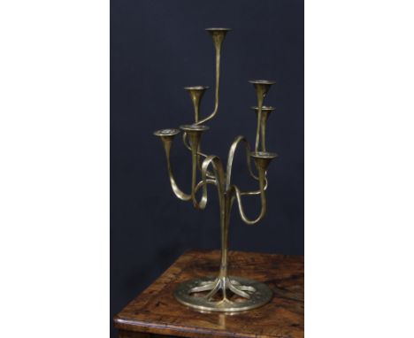 A Jugendstil or Art Nouveau style brass seven-light candelabrum, possibly Bäckhaus Solingen, sinuous organic branches, 49.5cm