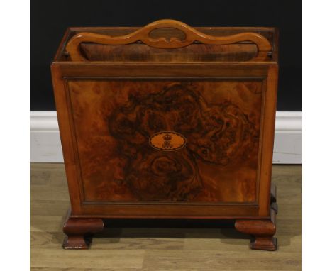 An early 20th century burr walnut and mahogany two section periodical rack, pierced carry handle, panel sides, the front inla