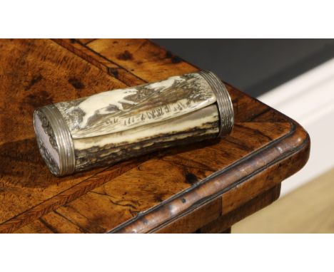 A 19th century silver coloured metal mounted stag’s antler snuff or tobacco box, hinged cover carved with a hunting dog and w