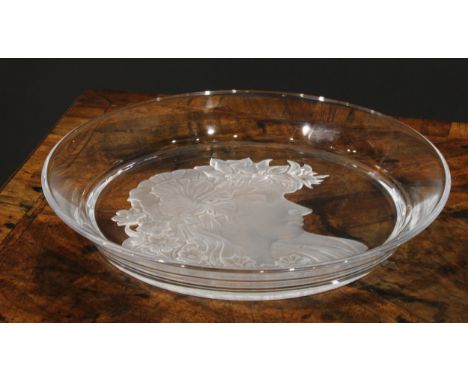 An Art Nouveau style glass circular tray, etched with a bust length portrait of a girl, her flowing sinuous hair adorned with