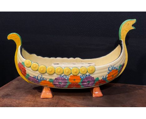 A Clarice Cliff Bizarre Gayday pattern table centre, modelled as a Viking long boat, with removable ceramic flower frog, 40.5