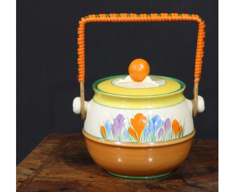 A Clarice Cliff Crocus pattern biscuit barrel and cover, painted in bright colours, wicker handle, 15.5cm high to finial, pri