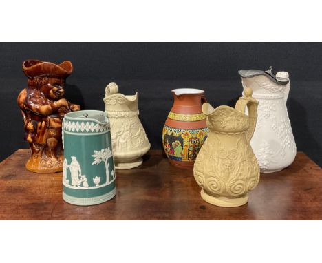 A 19th century Charles Meigh style stoneware jug, relief moulded with Bacchus masks, acanthus and  fruiting vine, the handle 