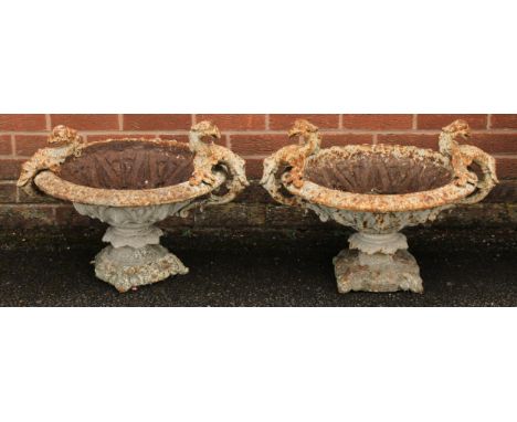 A 19th century cast iron garden urn, the shoulders cast and applied with cockatrice, 46cm high, 65cm wide overall