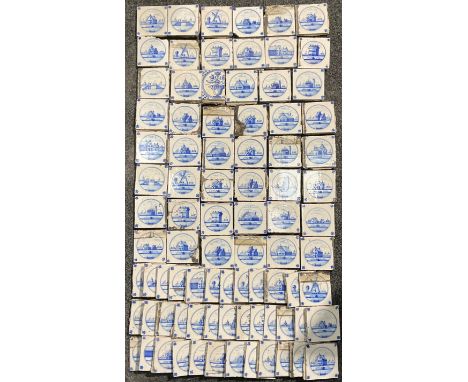 A quantity of Delftware blue and white tiles, predominantly decorated in the traditional manner with architectural landscapes
