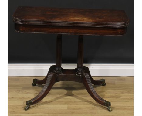 A George IV mahogany card table, in the manner of Gillows of Lancaster and London, hinged top with reeded edge enclosing a ba