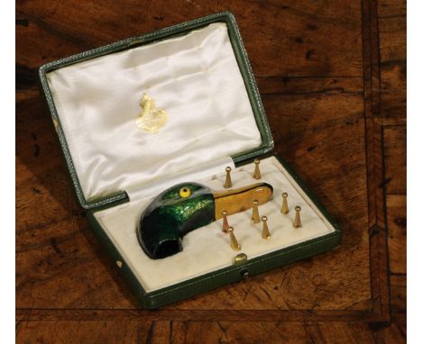 An early 20th century enamel novelty parasol handle, as the head of a mallard duck, 7cm long, eight gilt metal tips en suite,