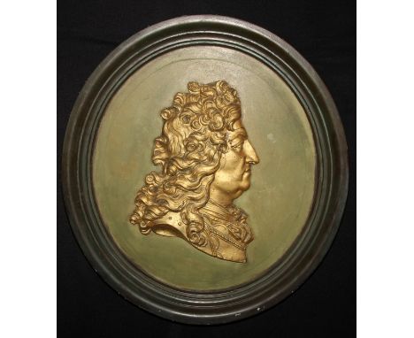 Interior design - large gilt cameo oval framed wall hanging portrait bust of louis XIV, against a shaded green ground, olive 