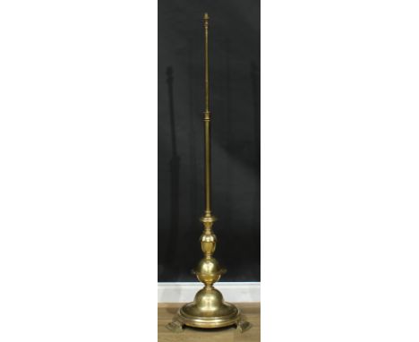 Interior Design - a parcel-dezincified brass telescopic floor lamp, circular base, bracket feet, 119cm extending to 164cm hig