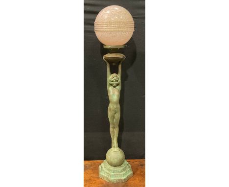 An Art Deco style copper figural table lamp, as a female nude, glass globular shade, stepped octagonal base, mid-20th century