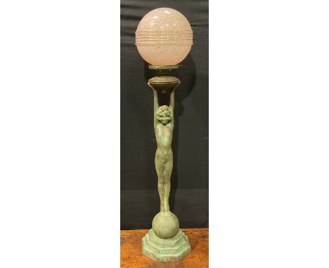 An Art Deco style copper figural table lamp, as a female nude, glass globular shade, stepped octagonal base, mid-20th century