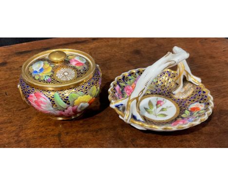 A Spode compressed globular jar and cover, finely painted in coloured enamels with flowers and leaves, on a blue and gilt sca