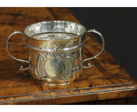 A Queen Anne Britannia silver porringer, scroll handles, 15cm wide, London 1707, 142g 