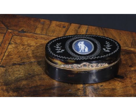 An early 19th century Neo-Classical tortoiseshell and silver pique oval snuff box, hinged cover set with a jasperware cameo p