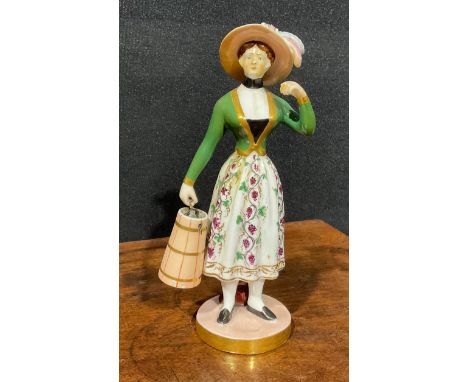 A Chamberlains Worcester figure, of a milkmaid, she stands wearing a bonnet, green bodice and floral skirt, carrying a cooper